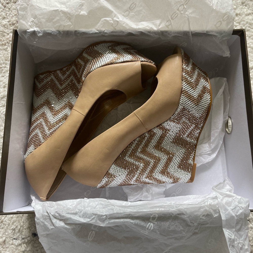 BEBE WEDGES! BRAND NEW!!! Metallic with Tan leather! Size: 6. Comes with Box!
